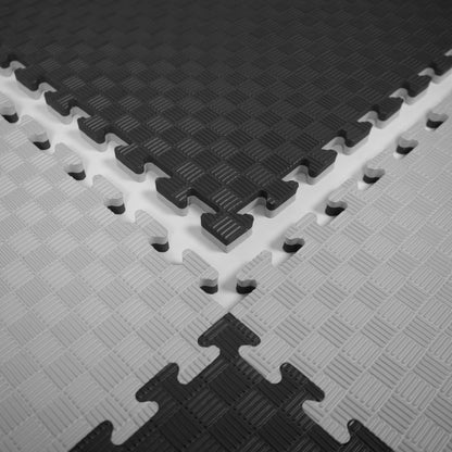 Kampfsport Puzzlematte 100 x 100 cm in Schwarz, Grau und Weiß mit rutschfester Oberfläche. Ideal als Bodenmatte für Fitness und Gymnastik.