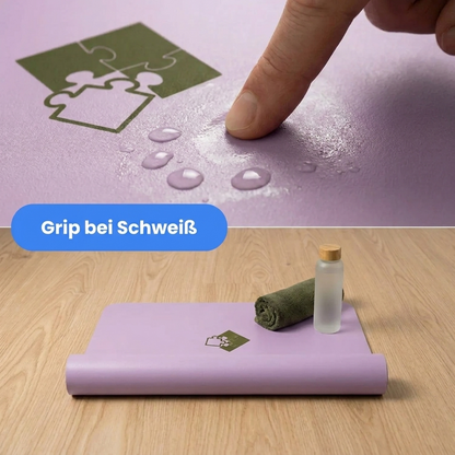 Yogamatte PUREFLOW PRO aus Naturkautschuk und PU-Leder in Lila mit rutschfester Struktur und Schweißabsorption.